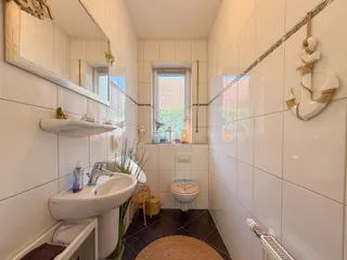 Wohnen auf zwei Ebenen in Haselünne: Großzügiger und stilvoller Bungalow mit neuwertiger Küche, Garage und Wintergarten! Bild 23