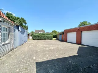 Gepflegtes Ein- bis Zweifamilienhaus mit diversen Garagen und Werkstätten zu verkaufen! Bild 7