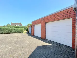 Gepflegtes Ein- bis Zweifamilienhaus mit diversen Garagen und Werkstätten zu verkaufen! Bild 12