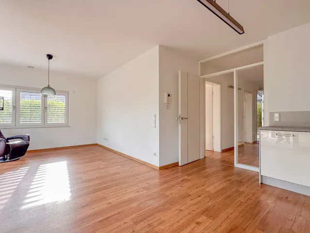 Emsauenpark: Hochwertige Erdgeschosswohnung mit Garten und Tiefgaragenstellplatz zu kaufen! KfW55!